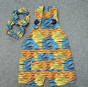 Yellow, orange and blue spotted tiger stripped overalls and two scrunchies.